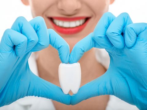 dentist explaining link between heart disease and gum disease
